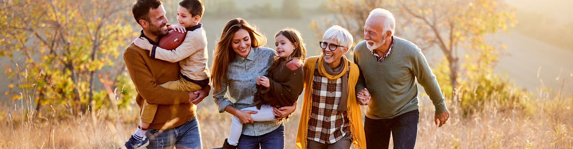 Generational family walking in a prairie side-by-side